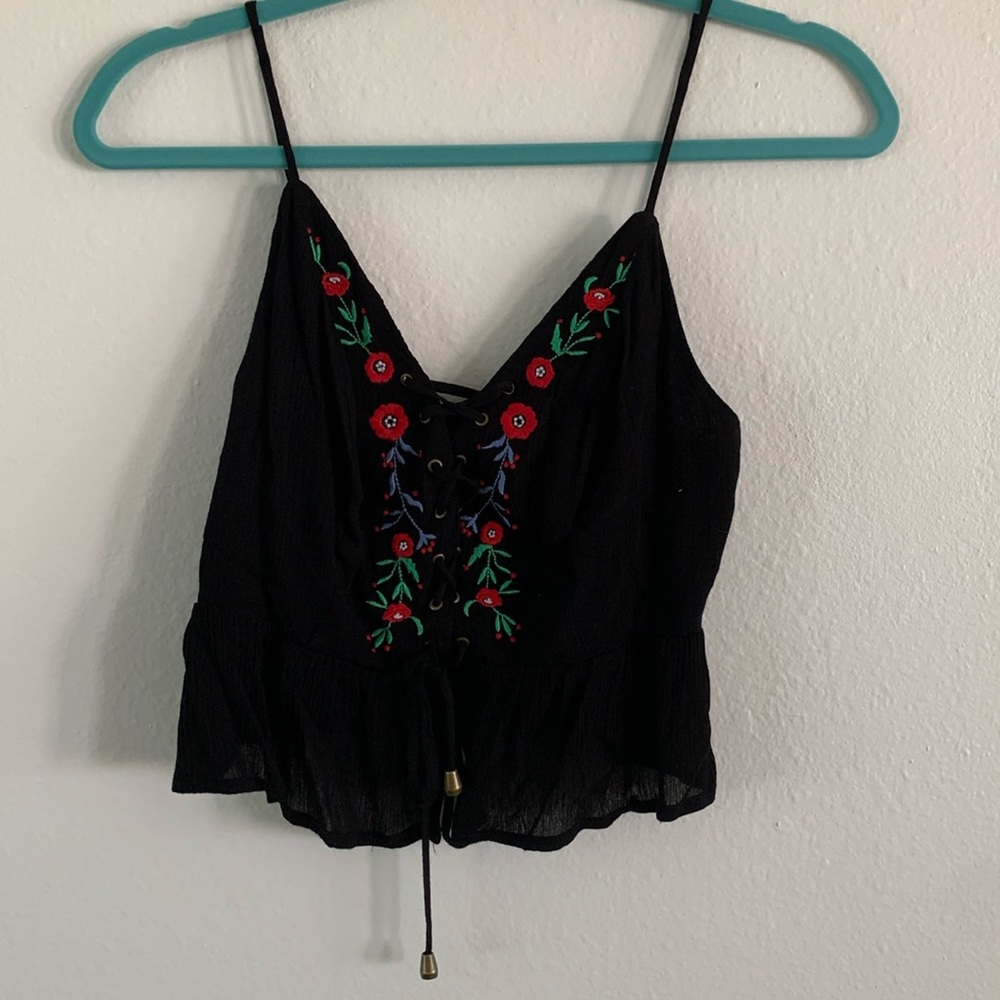 Corset crop top with flower embroidery and ruffle hem. Size S